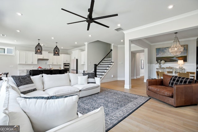 247 Widener Way, Peachtree City, GA 30269 - living area featuring ceiling fan, stairs, light wood-style floors, recessed lighting, and a chandelier