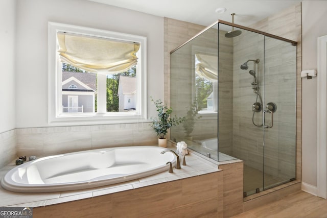 247 Widener Way, Peachtree City, GA 30269 - bathroom featuring a shower stall, healthy amount of natural light, and a bath