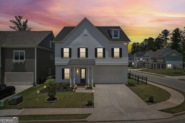 247 Widener Way, Peachtree City, GA 30269 - view of front of property with a garage, concrete driveway, a front lawn, a shingled roof, and metal roof