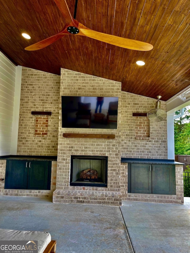 247 Widener Way, Peachtree City, GA 30269 - unfurnished living room featuring wooden ceiling, vaulted ceiling, and an outdoor brick fireplace