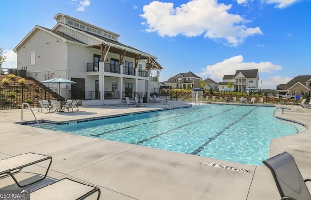 247 Widener Way, Peachtree City, GA 30269 - community pool with a patio area and a residential view