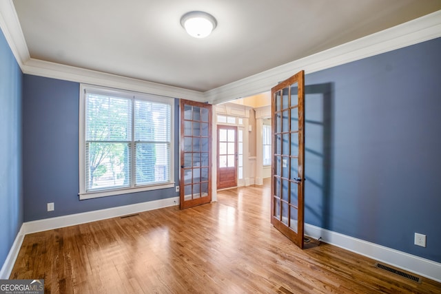 2604 Heltonwood Ct, Buford, GA 30519 - empty room with french doors, ornamental molding, baseboards, and wood finished floors