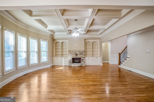 2604 Heltonwood Ct, Buford, GA 30519 - unfurnished living room with light wood-style floors, a ceiling fan, built in shelves, a fireplace, and beamed ceiling