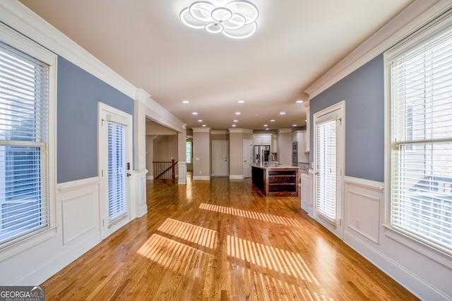 2604 Heltonwood Ct, Buford, GA 30519 - foyer with light wood-type flooring, a wainscoted wall, crown molding, a decorative wall, and recessed lighting