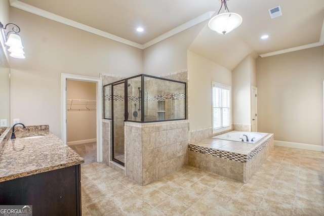 2604 Heltonwood Ct, Buford, GA 30519 - bathroom with a stall shower, vanity, a bath, a spacious closet, and ornamental molding
