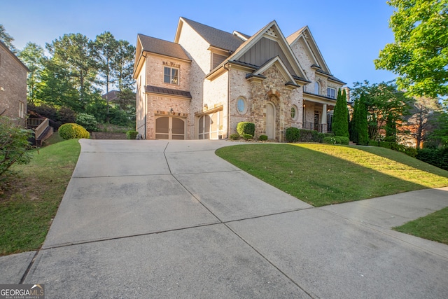2604 Heltonwood Ct, Buford, GA 30519 - view of front of property featuring an attached garage, concrete driveway, board and batten siding, and a front lawn