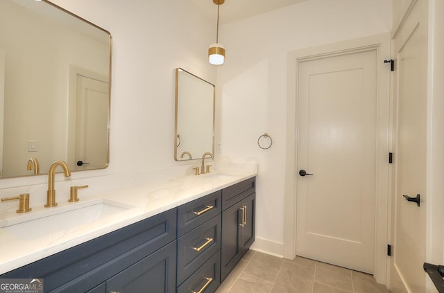 1947 Clark Dr, Tucker, GA 30084 - bathroom with double vanity, tile patterned floors, and baseboards