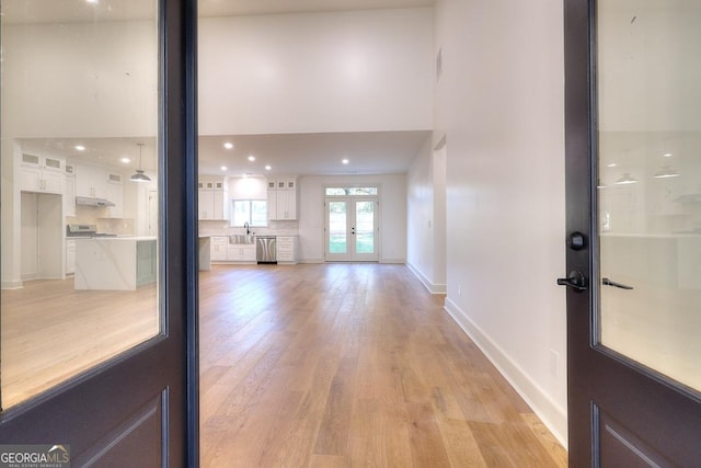 1947 Clark Dr, Tucker, GA 30084 - entryway featuring a towering ceiling, french doors, light wood-style floors, baseboards, and recessed lighting