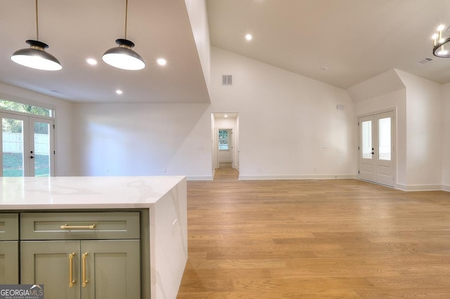 1947 Clark Dr, Tucker, GA 30084 - unfurnished living room featuring french doors, light wood-style floors, baseboards, high vaulted ceiling, and recessed lighting