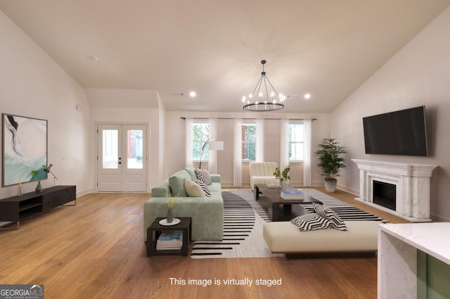 1947 Clark Dr, Tucker, GA 30084 - living area featuring vaulted ceiling, wood finished floors, baseboards, a chandelier, and recessed lighting