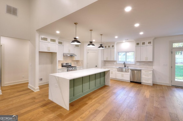 1947 Clark Dr, Tucker, GA 30084 - kitchen with stainless steel appliances, under cabinet range hood, a sink, white cabinets, and recessed lighting