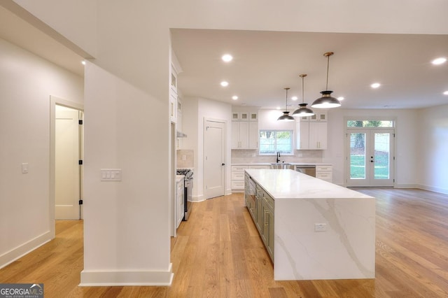 1947 Clark Dr, Tucker, GA 30084 - kitchen featuring white cabinets, stainless steel appliances, a center island, a sink, and recessed lighting