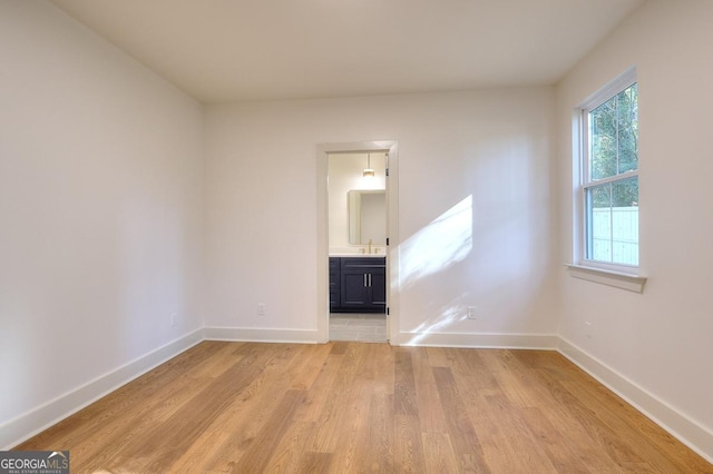 1947 Clark Dr, Tucker, GA 30084 - spare room with light wood-style flooring, baseboards, and a sink