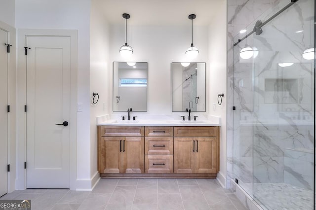 1947 Clark Dr, Tucker, GA 30084 - bathroom featuring a marble finish shower, baseboards, double vanity, and marble look tile flooring