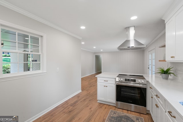 1173 Normandy Rd, Macon, GA 31210 - kitchen featuring stainless steel electric range, exhaust hood, a peninsula, crown molding, and light wood finished floors