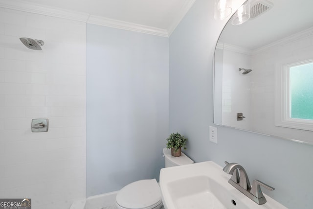 1173 Normandy Rd, Macon, GA 31210 - full bath featuring toilet, tiled shower, a sink, and crown molding