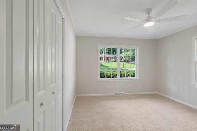 1173 Normandy Rd, Macon, GA 31210 - unfurnished bedroom featuring baseboards, carpet, ornamental molding, ceiling fan, and a closet