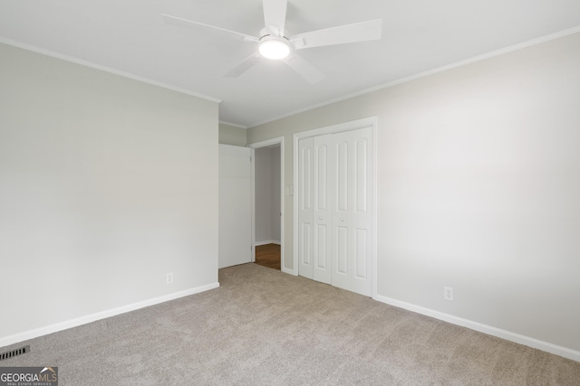 1173 Normandy Rd, Macon, GA 31210 - unfurnished bedroom featuring carpet, a closet, ornamental molding, baseboards, and ceiling fan