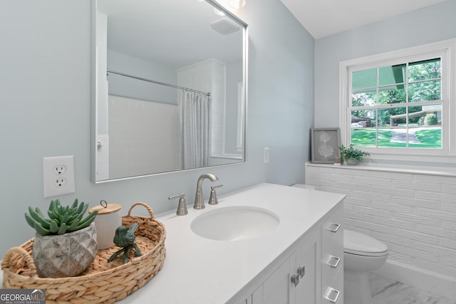 1173 Normandy Rd, Macon, GA 31210 - bathroom with vanity, toilet, marble look tile flooring, and curtained shower