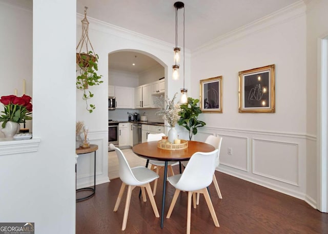 1850 Cotillion Dr Unit 2304, Atlanta, GA 30338 - dining room featuring wood finished floors, crown molding, and arched walkways