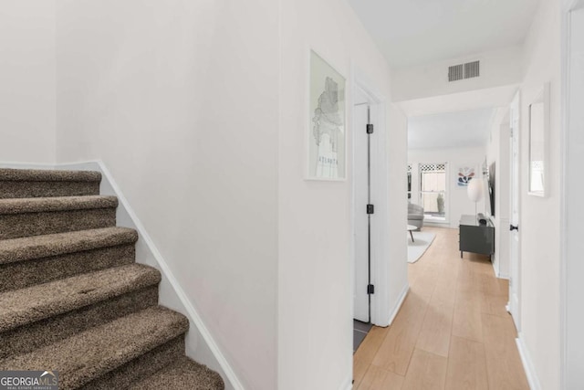 1701 Wiscasset Pl, Tucker, GA 30084 - stairs featuring wood finished floors and baseboards