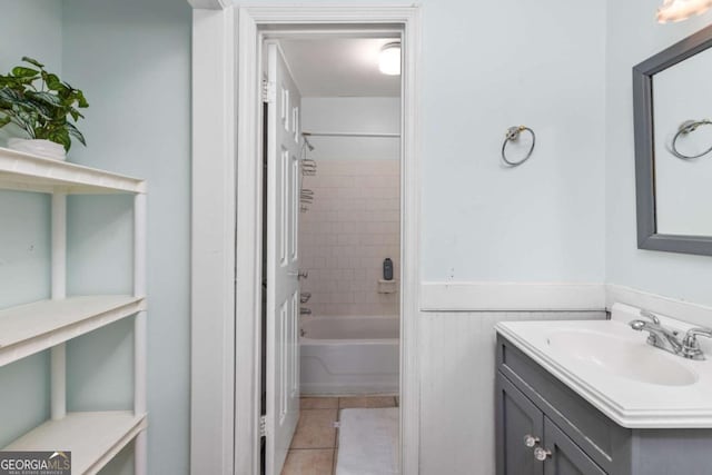 1701 Wiscasset Pl, Tucker, GA 30084 - full bath with vanity, tile patterned floors, wainscoting, and tub / shower combination