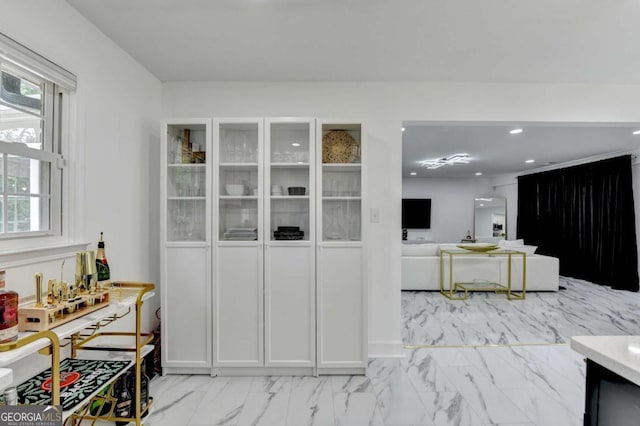 3799 Sweetbriar Cir, Lithia Springs, GA 30122 - kitchen featuring light marble finish flooring, recessed lighting, and white cabinetry