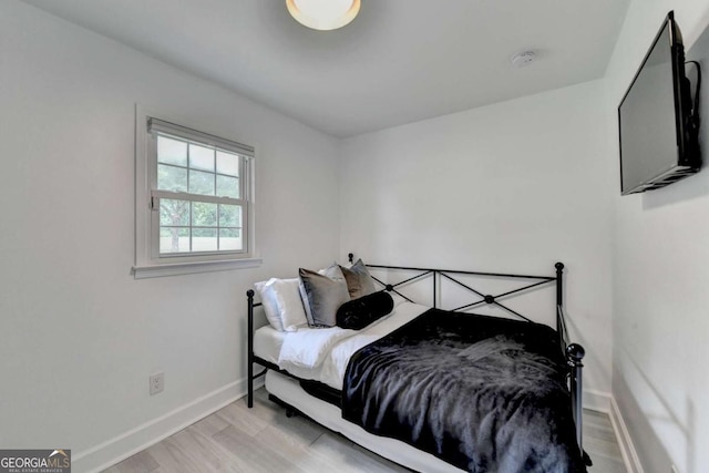 3799 Sweetbriar Cir, Lithia Springs, GA 30122 - bedroom with baseboards and light wood-style flooring