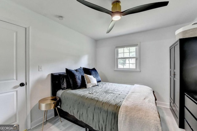 3799 Sweetbriar Cir, Lithia Springs, GA 30122 - bedroom featuring wood finished floors, baseboards, and a ceiling fan
