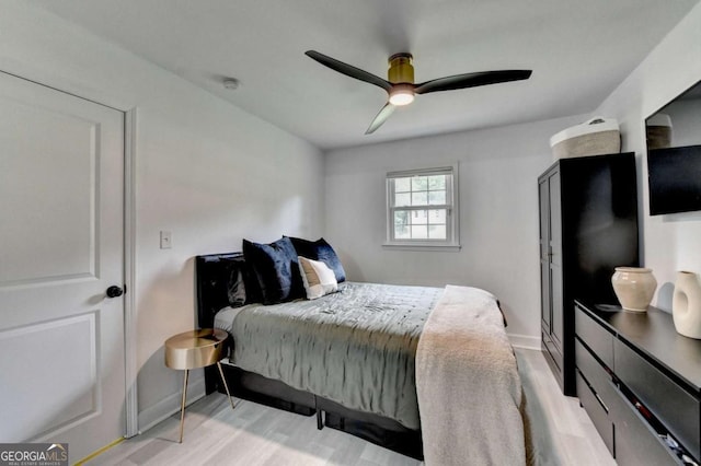 3799 Sweetbriar Cir, Lithia Springs, GA 30122 - bedroom featuring wood finished floors, baseboards, and ceiling fan
