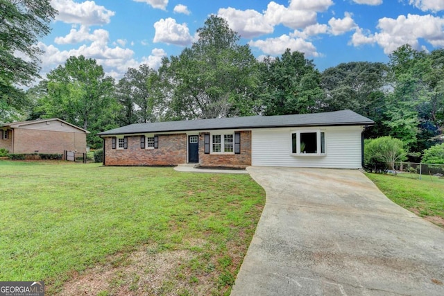 3799 Sweetbriar Cir, Lithia Springs, GA 30122 - ranch-style house featuring concrete driveway, brick siding, and view of scattered trees
