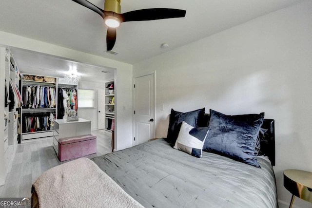 3799 Sweetbriar Cir, Lithia Springs, GA 30122 - bedroom with wood finished floors and a ceiling fan