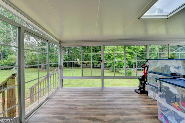 3799 Sweetbriar Cir, Lithia Springs, GA 30122 - unfurnished sunroom featuring a skylight, wood finished floors, and healthy amount of natural light
