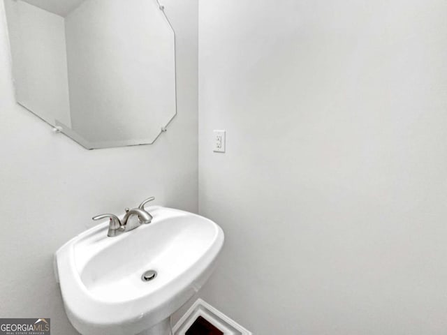 4311 Marci St, Snellville, GA 30039 - bathroom with a sink and baseboards