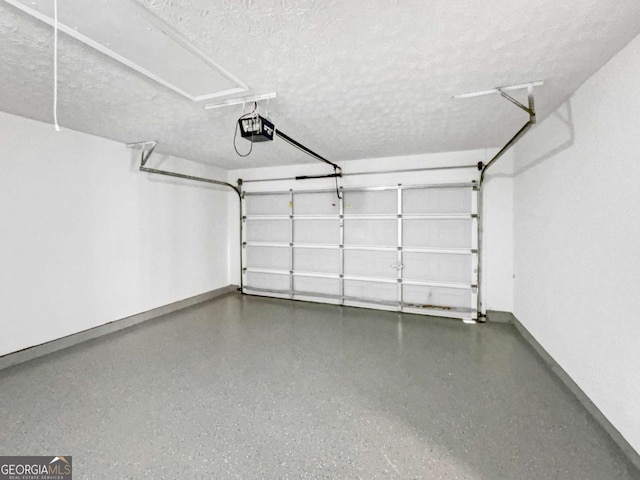 4311 Marci St, Snellville, GA 30039 - garage with baseboards and a garage door opener