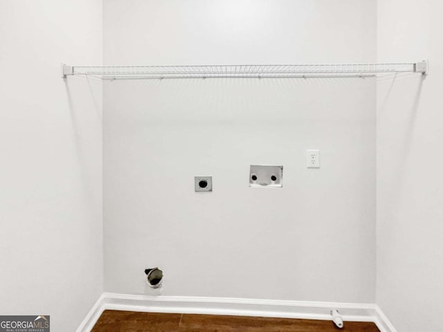 4311 Marci St, Snellville, GA 30039 - laundry area with electric dryer hookup, baseboards, hookup for a washing machine, and dark wood-type flooring