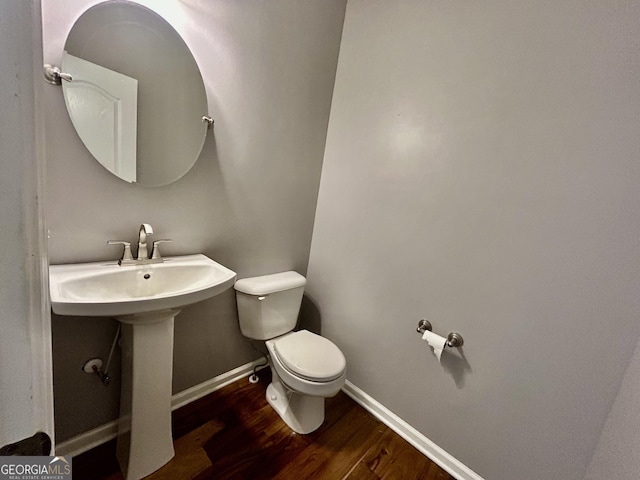 3988 Church View Ln, Suwanee, GA 30024 - half bath featuring wood finished floors and toilet