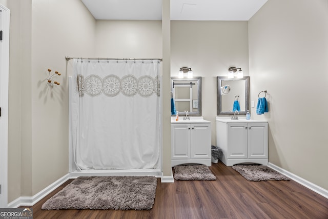 21 Little Creek Dr, Monroe, GA 30655 - full bath with wood finished floors, vanity, and a shower with shower curtain