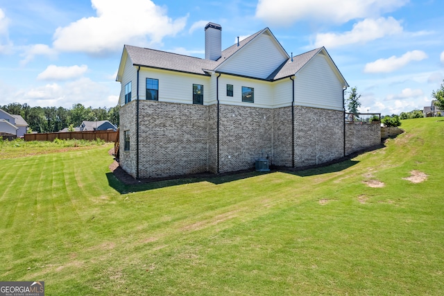 21 Little Creek Dr, Monroe, GA 30655 - back of property featuring a chimney and brick siding