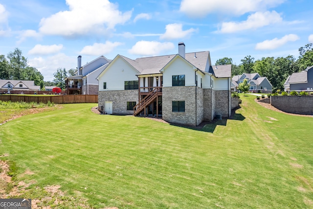 21 Little Creek Dr, Monroe, GA 30655 - rear view of house featuring stone siding, stairway, a chimney, a deck, and a residential view