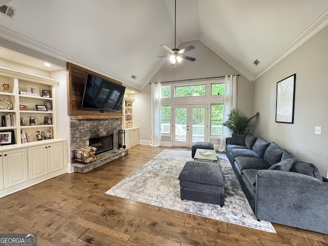 1761 Turtle Pond Dr, Watkinsville, GA 30677 - living area with a ceiling fan, wood-type flooring, a stone fireplace, crown molding, and high vaulted ceiling