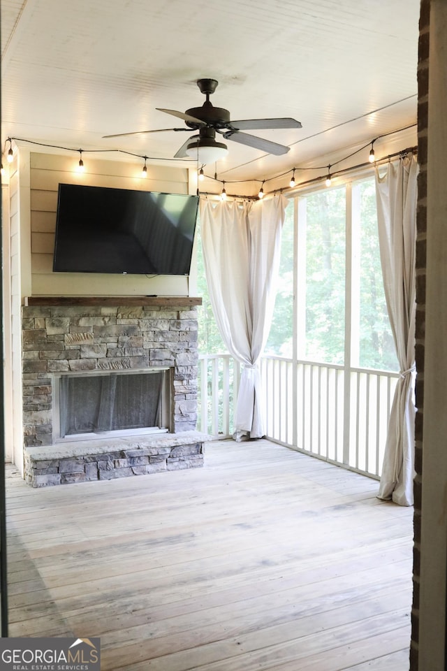 1761 Turtle Pond Dr, Watkinsville, GA 30677 - unfurnished living room featuring ceiling fan, a fireplace, and wood finished floors