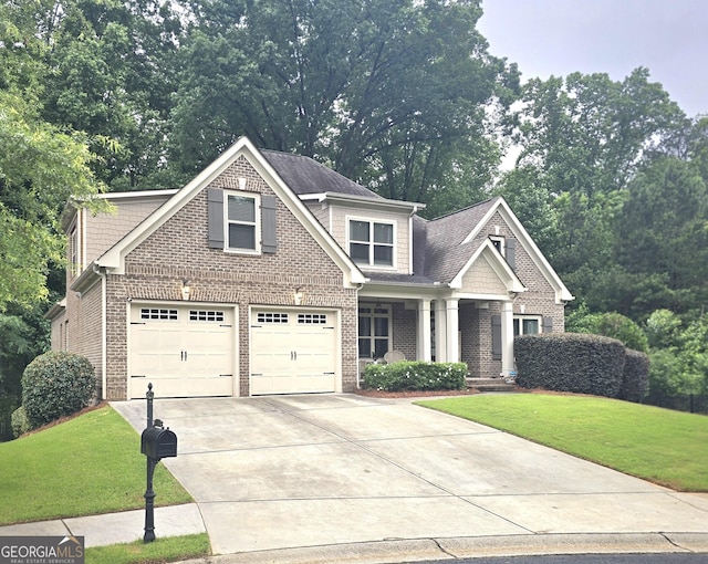 1761 Turtle Pond Dr, Watkinsville, GA 30677 - view of front of house featuring a front lawn, concrete driveway, brick siding, and a garage