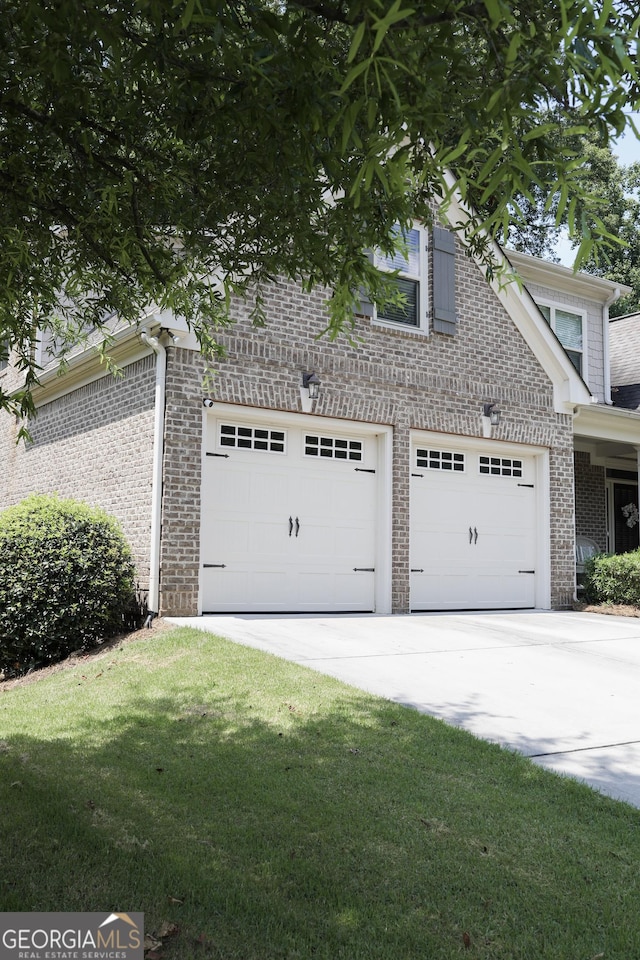 1761 Turtle Pond Dr, Watkinsville, GA 30677 - view of front of home with driveway, brick siding, and a front lawn