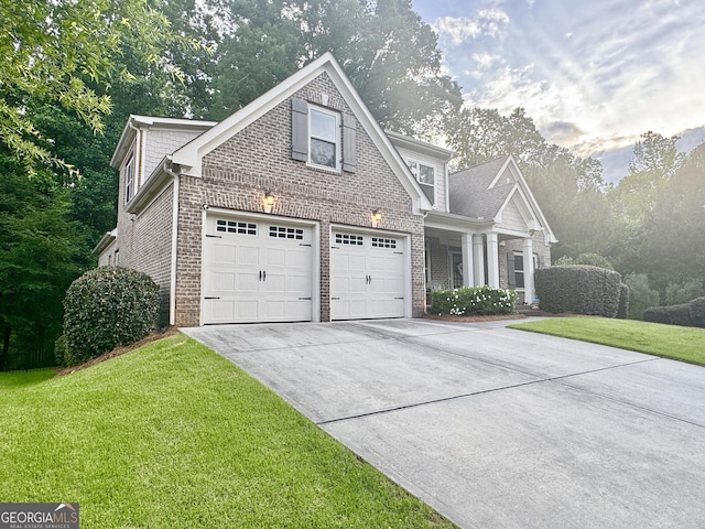 1761 Turtle Pond Dr, Watkinsville, GA 30677 - view of front facade featuring brick siding, concrete driveway, and a front lawn
