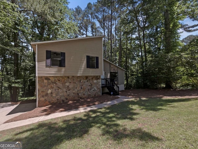 3924 Chimney Ridge Ct, Ellenwood, GA 30294 - view of front of home featuring stone siding and a front yard