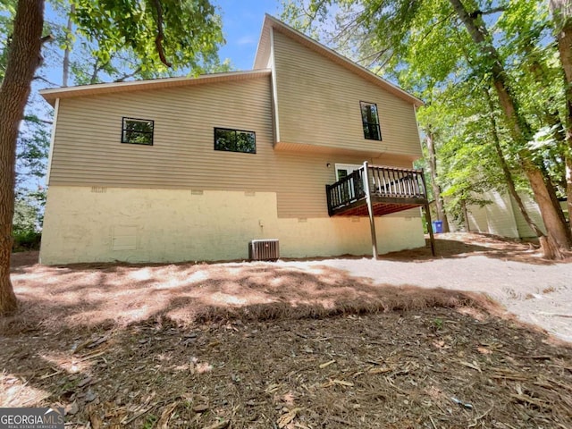 3924 Chimney Ridge Ct, Ellenwood, GA 30294 - back of house with a deck, crawl space, and central AC