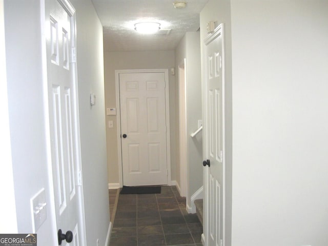 4383 Chestnut Lake Ave, Lithonia, GA 30038 - corridor with baseboards and dark tile patterned floors