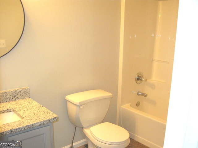 4383 Chestnut Lake Ave, Lithonia, GA 30038 - bathroom featuring vanity, toilet, baseboards, and bathtub / shower combination