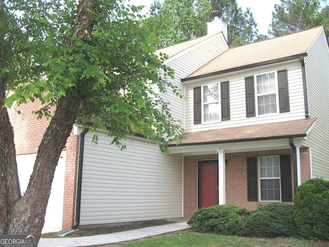 4383 Chestnut Lake Ave, Lithonia, GA 30038 - view of front of home featuring a chimney, brick siding, covered porch, and a shingled roof